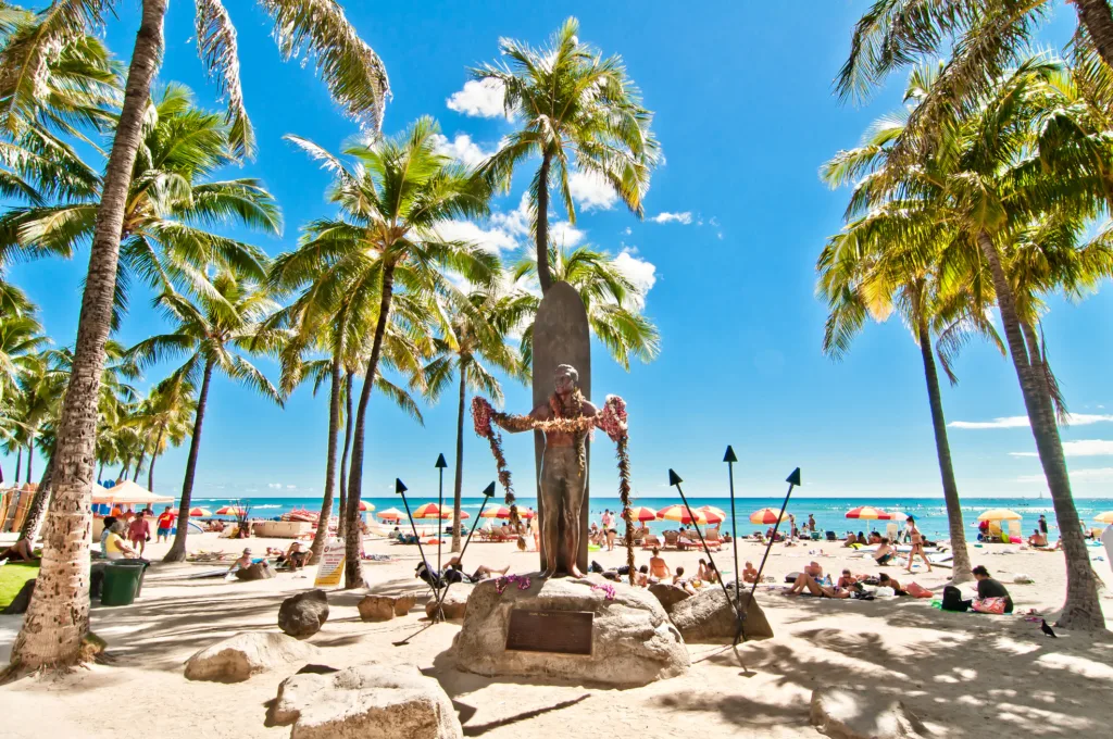 ourists sunbathing on Waikiki beach in Honolulu, Hawaii. Waikiki white sand beach shoreline is Hawaii s most famous beach.