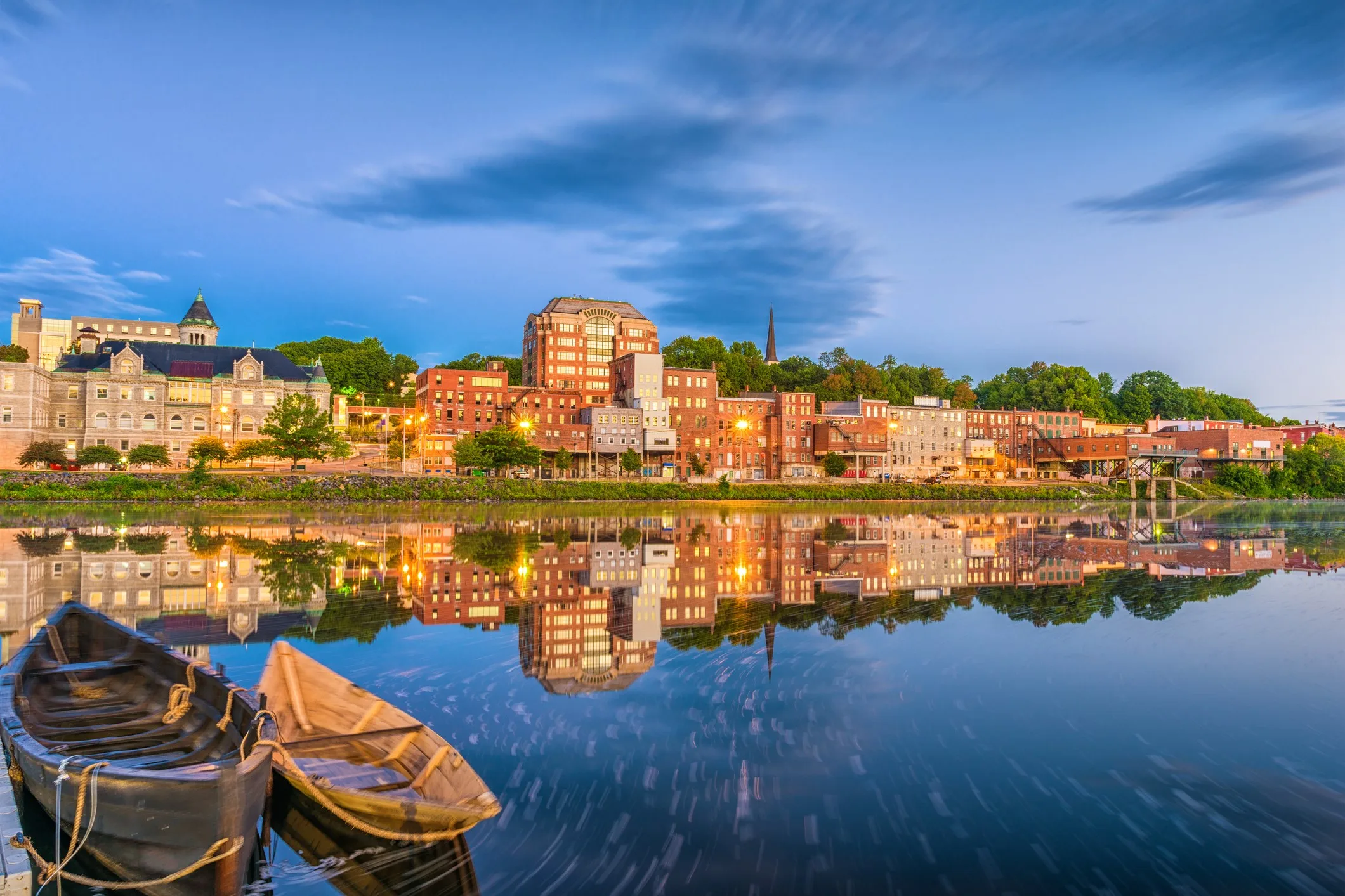 Augusta, Maine, USA skyline and boats on the river.