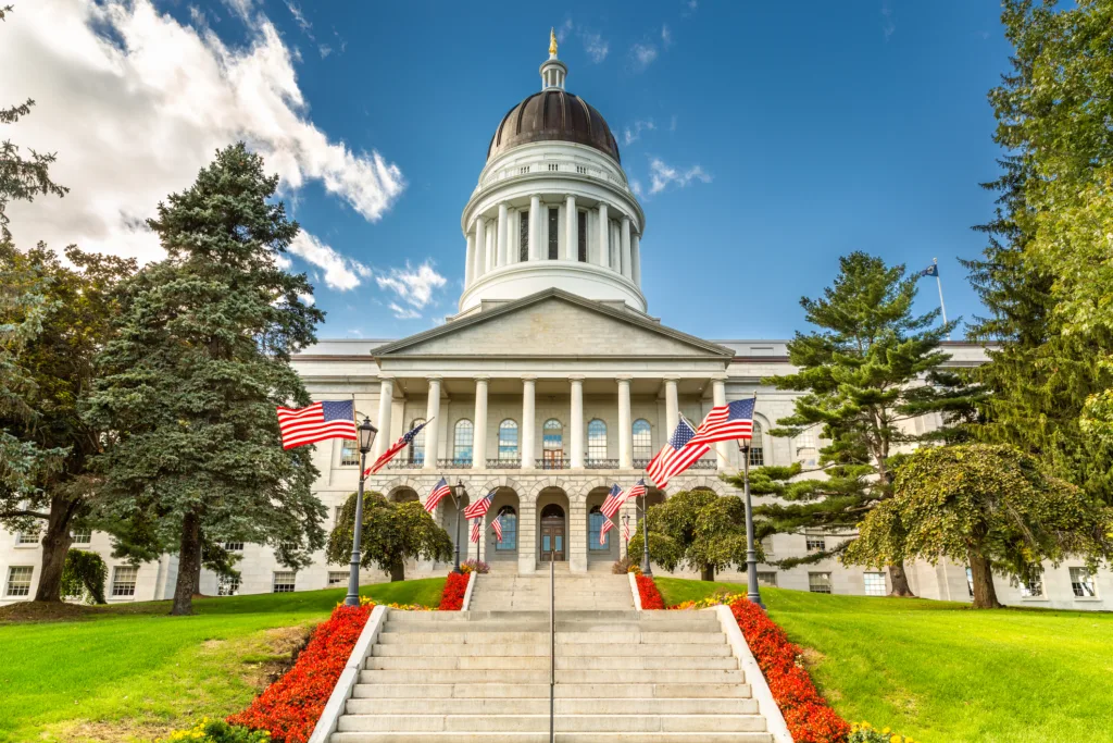 Maine State House, in Augusta, on a sunny day.