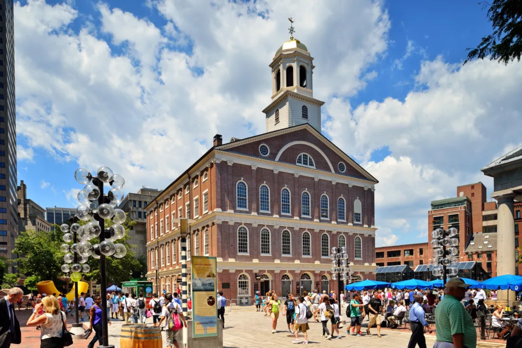 A crowd of tourists and locals visit Faneuil Hall, Boston Massachusetts, United States