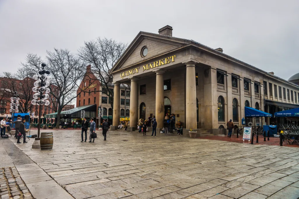 Quincy Market at Faneuil Hall Marketplace in downtown Boston, Massachusetts, the United States. People in the background.